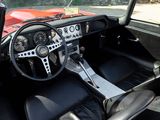 a dashboard and steering wheel of a classic car