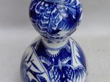 a blue and white vase with a blue and white design on it
