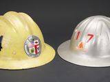 two hard hats that are sitting next to each other