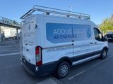 an image of a white van parked in a parking lot