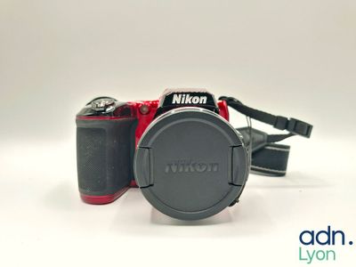 a camera that is sitting on a white surface