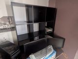 a desk with a computer and a printer on it