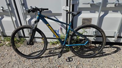 a bike that is parked in front of a container