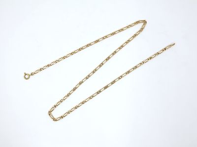 a gold chain on a white background