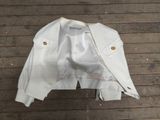 a white jacket on a wooden floor on a wooden floor