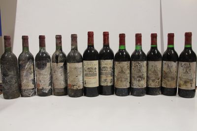 several bottles of wine are lined up in a row on a table