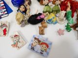 a lot of little dolls on the table together