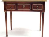 a small wooden table with two drawers on it