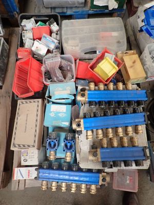 many different types of valves and fittings in a box