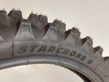 a close up of a tire on a white surface