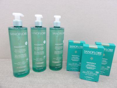 a group of three bottles of skin care products sitting next to each other