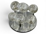 a glass plate with a bunch of glass balls on it