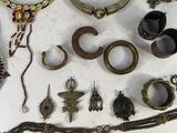 a lot of jewelry that is on the table