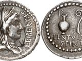 a silver coin with an image of a woman on it