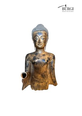 an image of a statue of a buddha holding a pipe