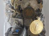 a bag of assorted buttons and other items in it