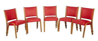 four red leather chairs with wooden legs and back rests against a white background