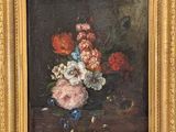 painting of flowers in a vase on a table with a gold frame