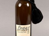 a bottle of wine with a black ribbon around it