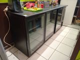 an image of a kitchen with a refrigerator and a counter