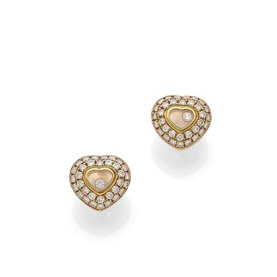 a pair of diamond and eighteen karat gold heart earrings