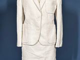 an image of a woman ' s white suit and skirt on a mannequin