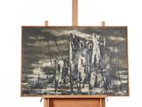a painting on a easel with a picture of a castle in the background