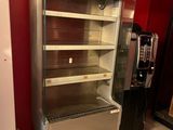 an image of a refrigerator in a room with a red wall