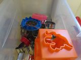 a plastic container filled with assorted keys and keys