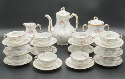 a picture of a table setting with a tea pot and cups