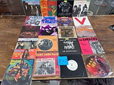 a lot of records on a table with a record on it