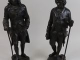 pair of bronze figurines of a man and a woman
