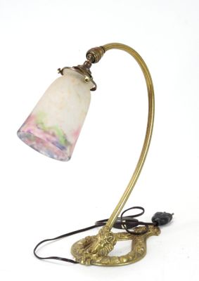 brass table lamp with a marble shade and a black cord
