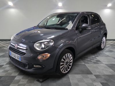 the grey fiat suv is parked on a checkered floor