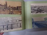 a person holding an open book with pictures on it