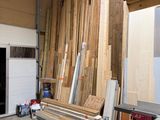 several pieces of wood are stacked up in a garage