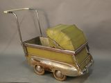 a toy truck with a cart full of luggage on it