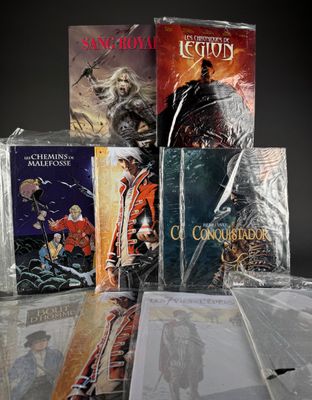 a lot of books that are sitting on top of a table
