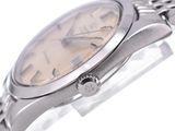 a close up of a wrist watch on a white surface