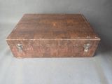 a small wooden box that is sitting on a table