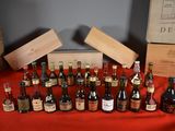 several bottles of wine are lined up on a table