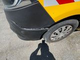 a yellow and red sign on the side of a car