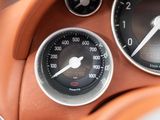 a close up of a speedometer and gauges in a car