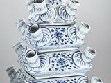 tall blue and white vases stacked on top of each other