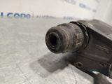 an image of a close up of a drill on a table