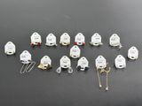a lot of small white ghost figurines on a table