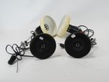 a pair of black and white speakers on a white surface