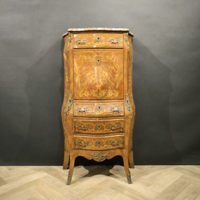 an old wooden cabinet with a drawer on top of it