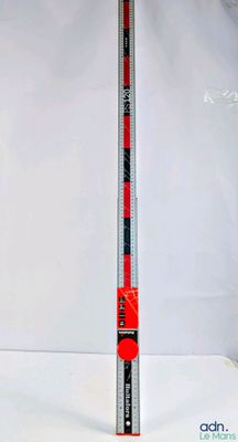 a close up of a ruler on a white surface