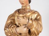 an image of a statue of a man holding a cat